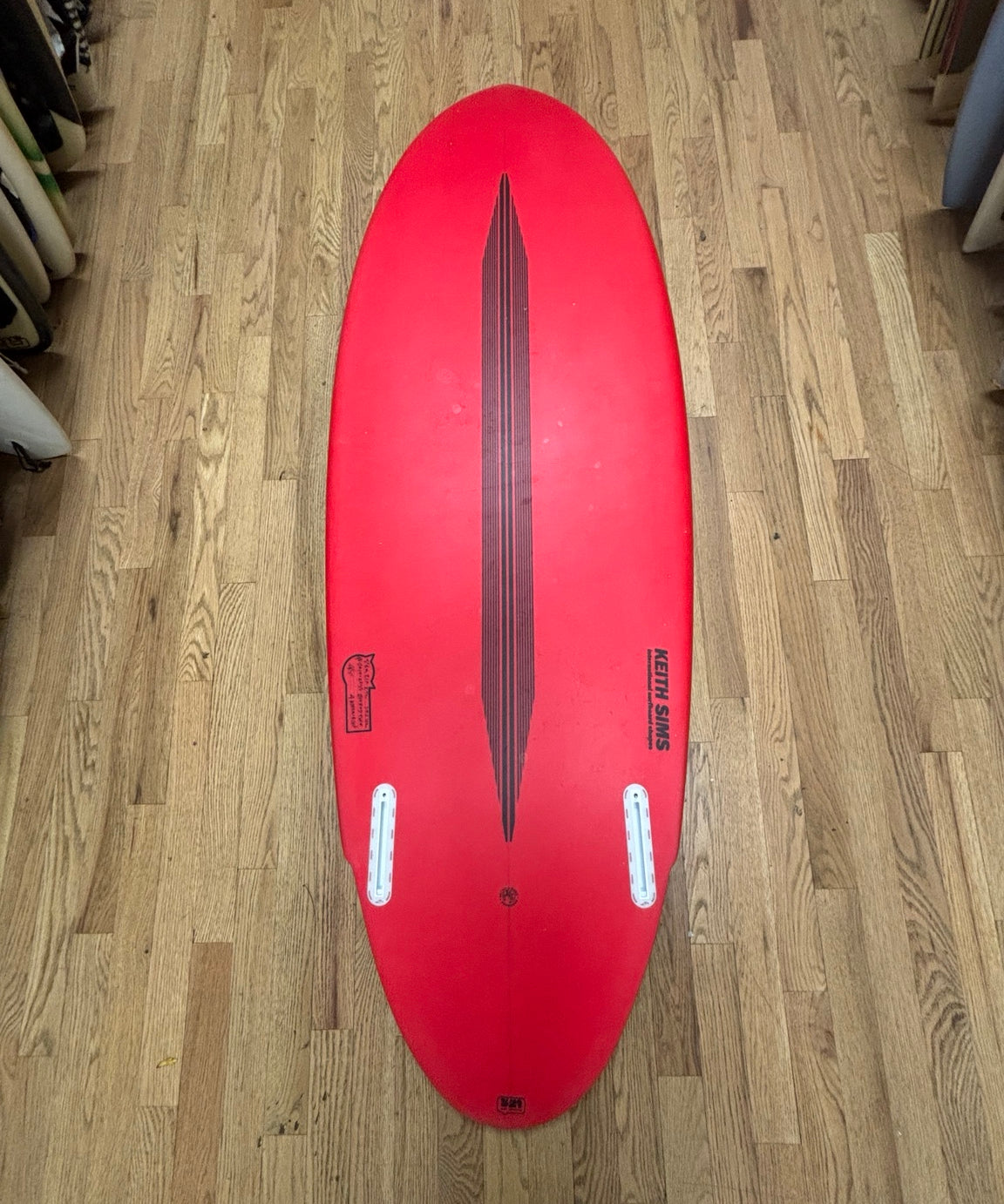 Red Fat Cat 5 foot 6 twin fin surfboard bottom
